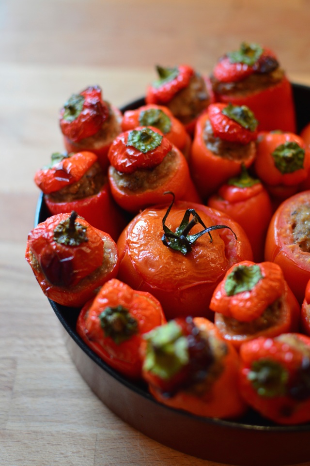 Roasted stuffed peppers and tomatoes